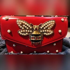 Red Designer Crossbody Bag with Gold Accents